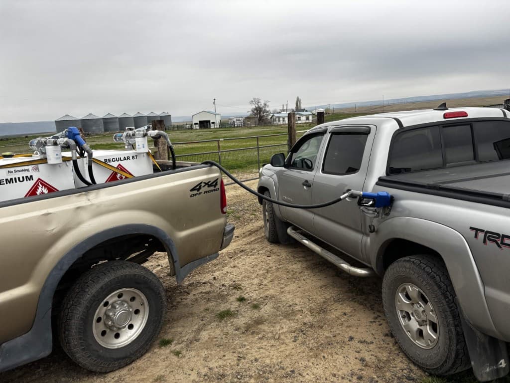Rapid Refuel truck fueling a Toyota Tacoma on a ranch
